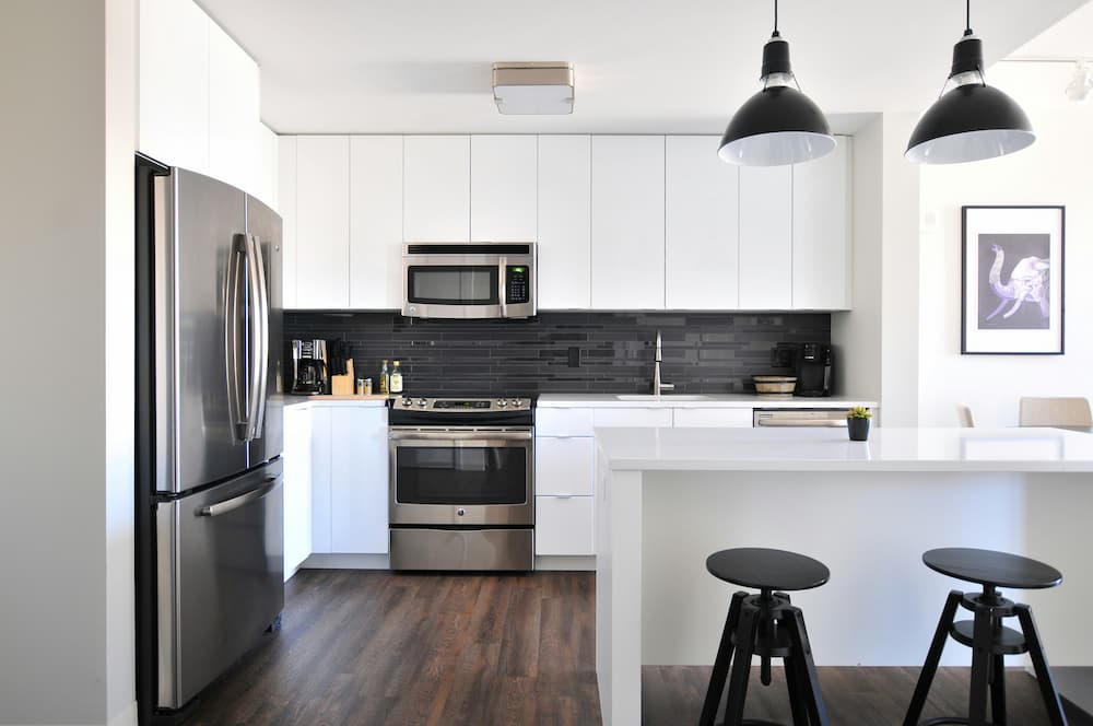 Hand-built Shaker kitchen with painted island in a Barnet extension